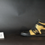 Chaussures Huneak en cuir noir et or
